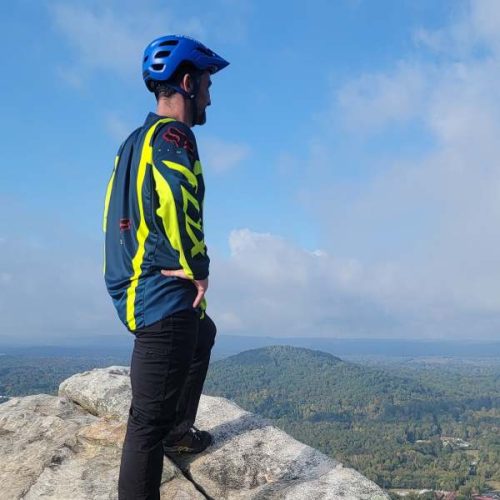 Jason "JT" Thomas on a mountain peak